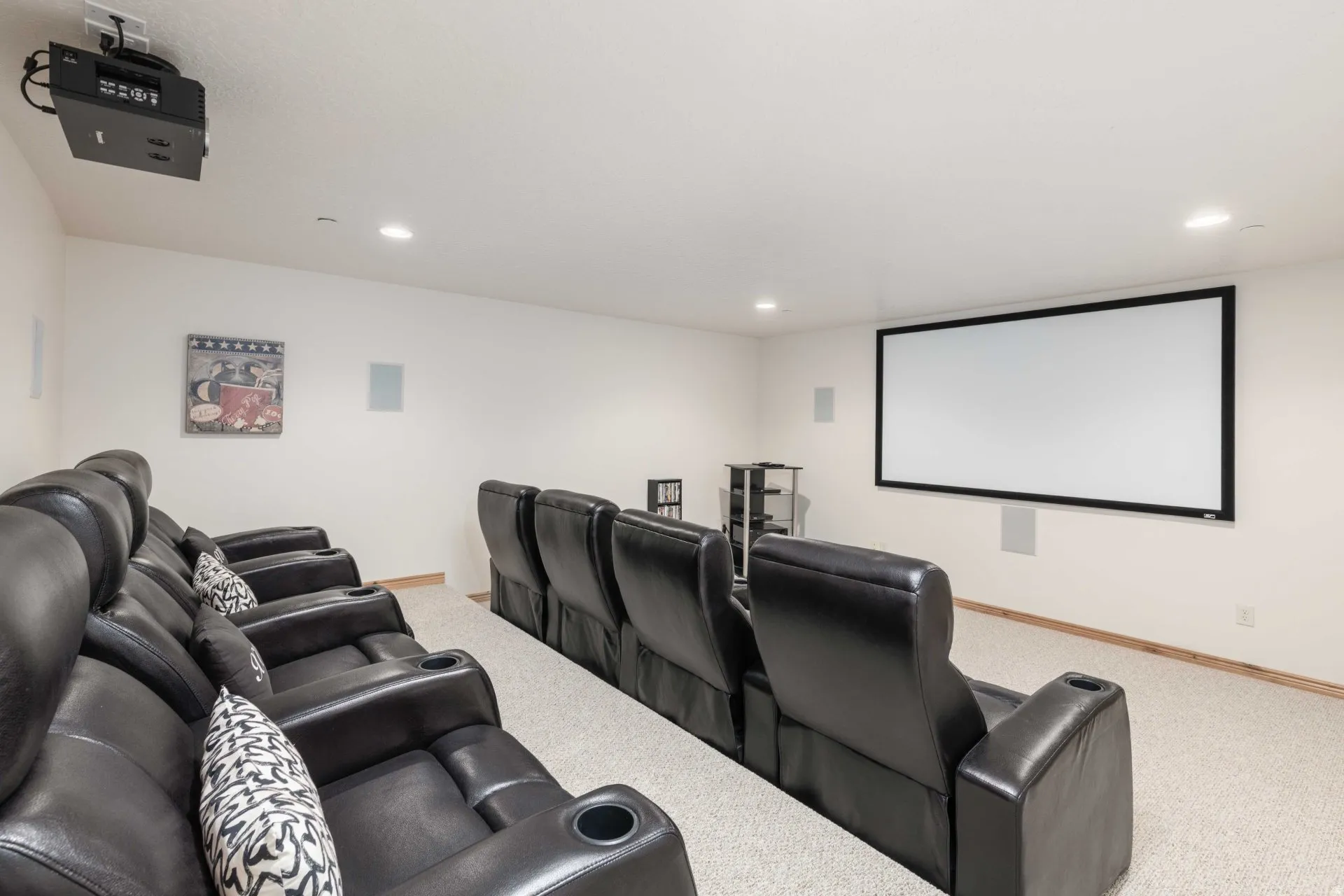 Cinema featuring light carpet and recessed lighting