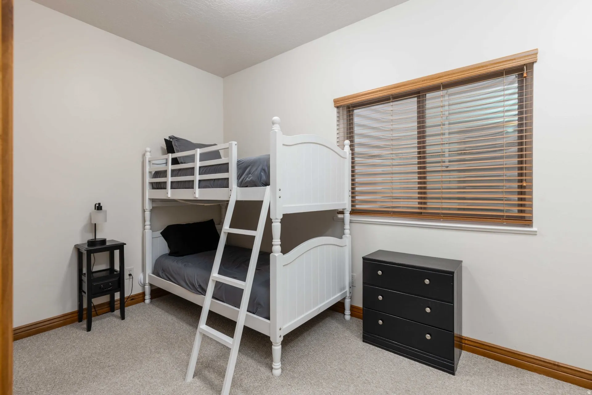 Bedroom with light carpet