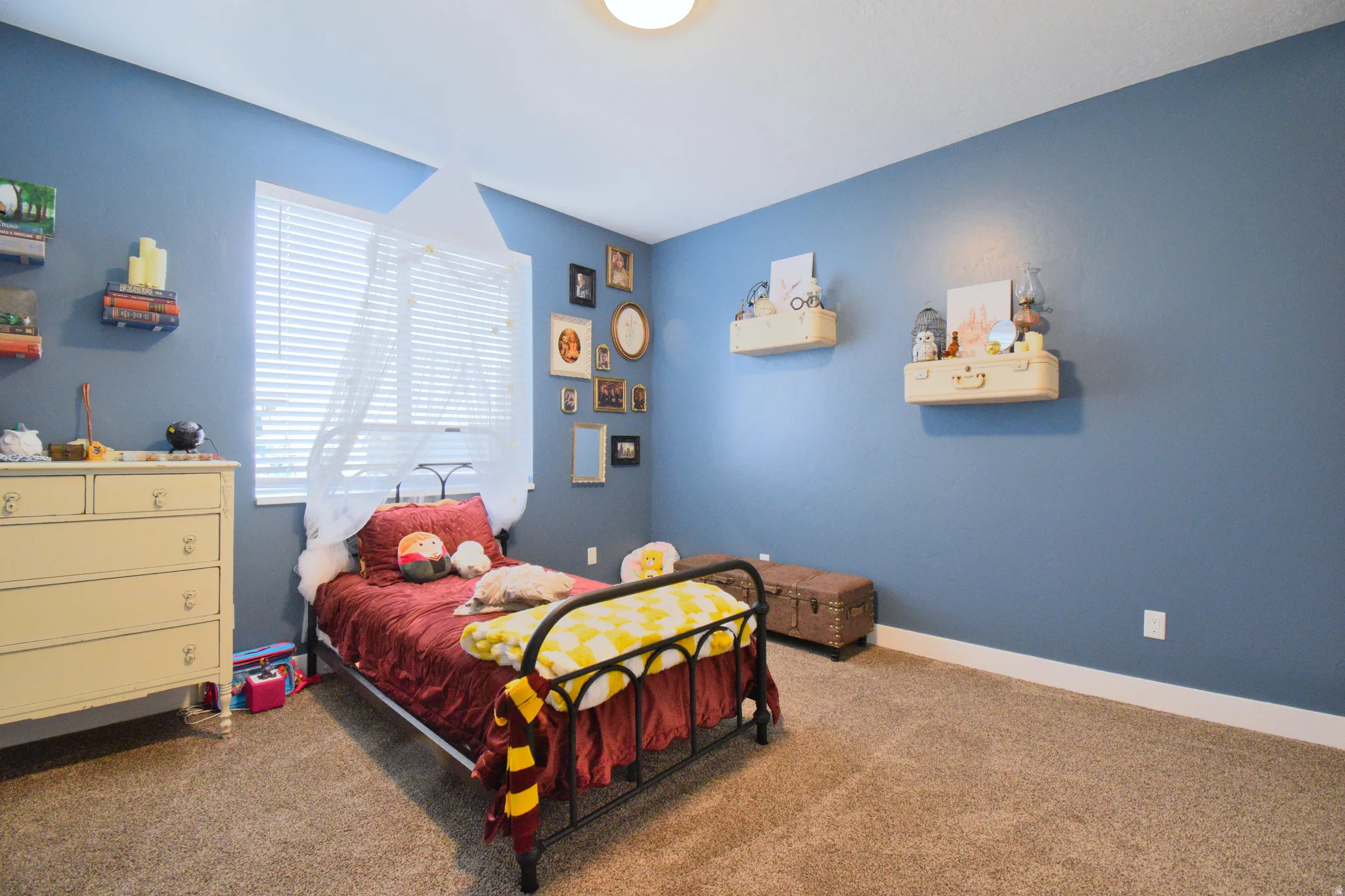 Bedroom with carpet floors and baseboards
