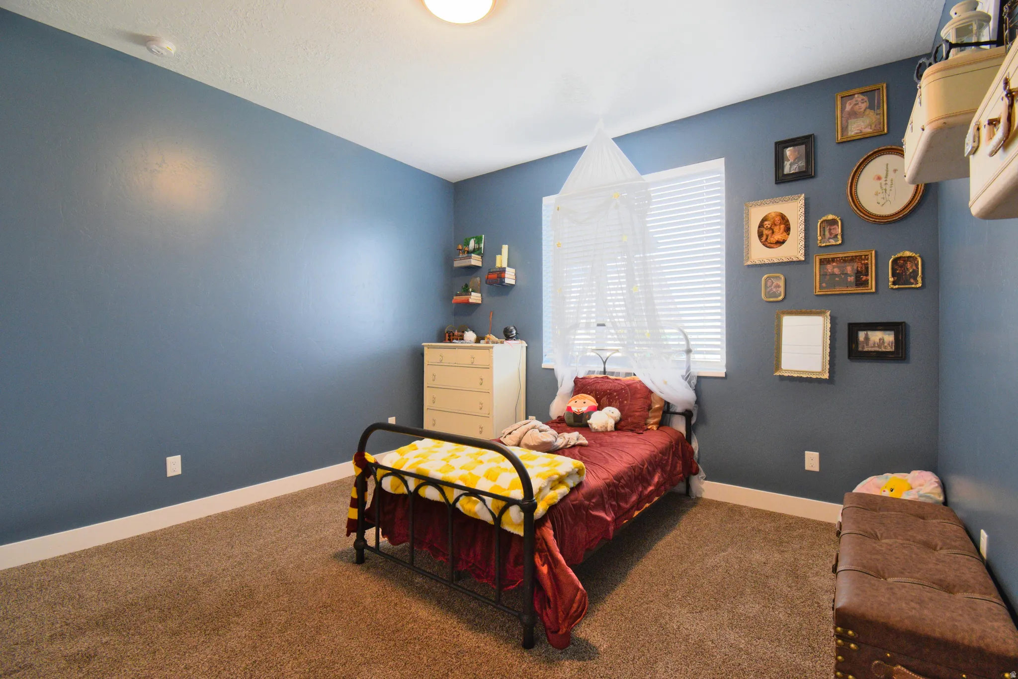 Bedroom with carpet and baseboards