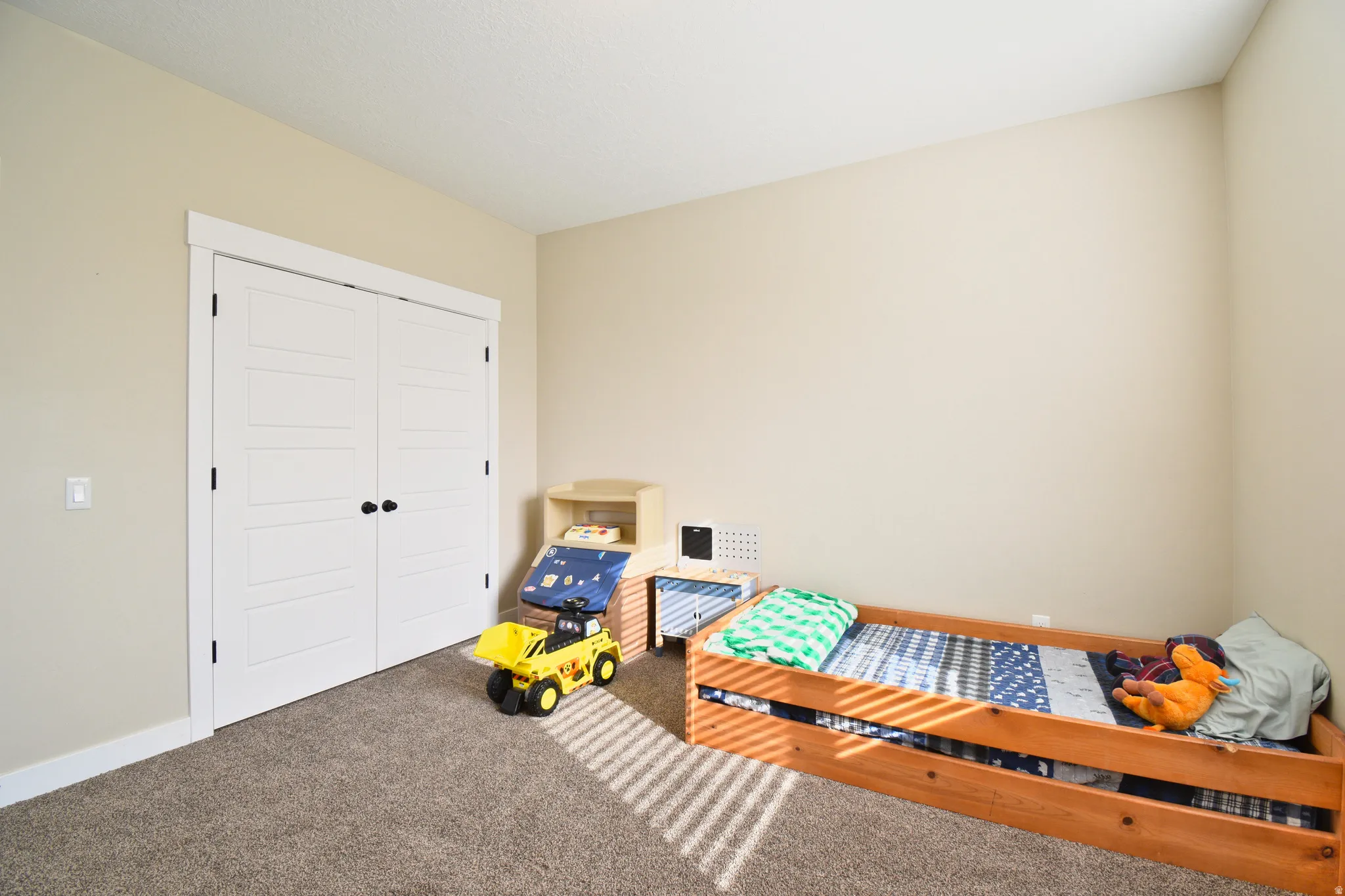 Bedroom featuring carpet floors and a closet