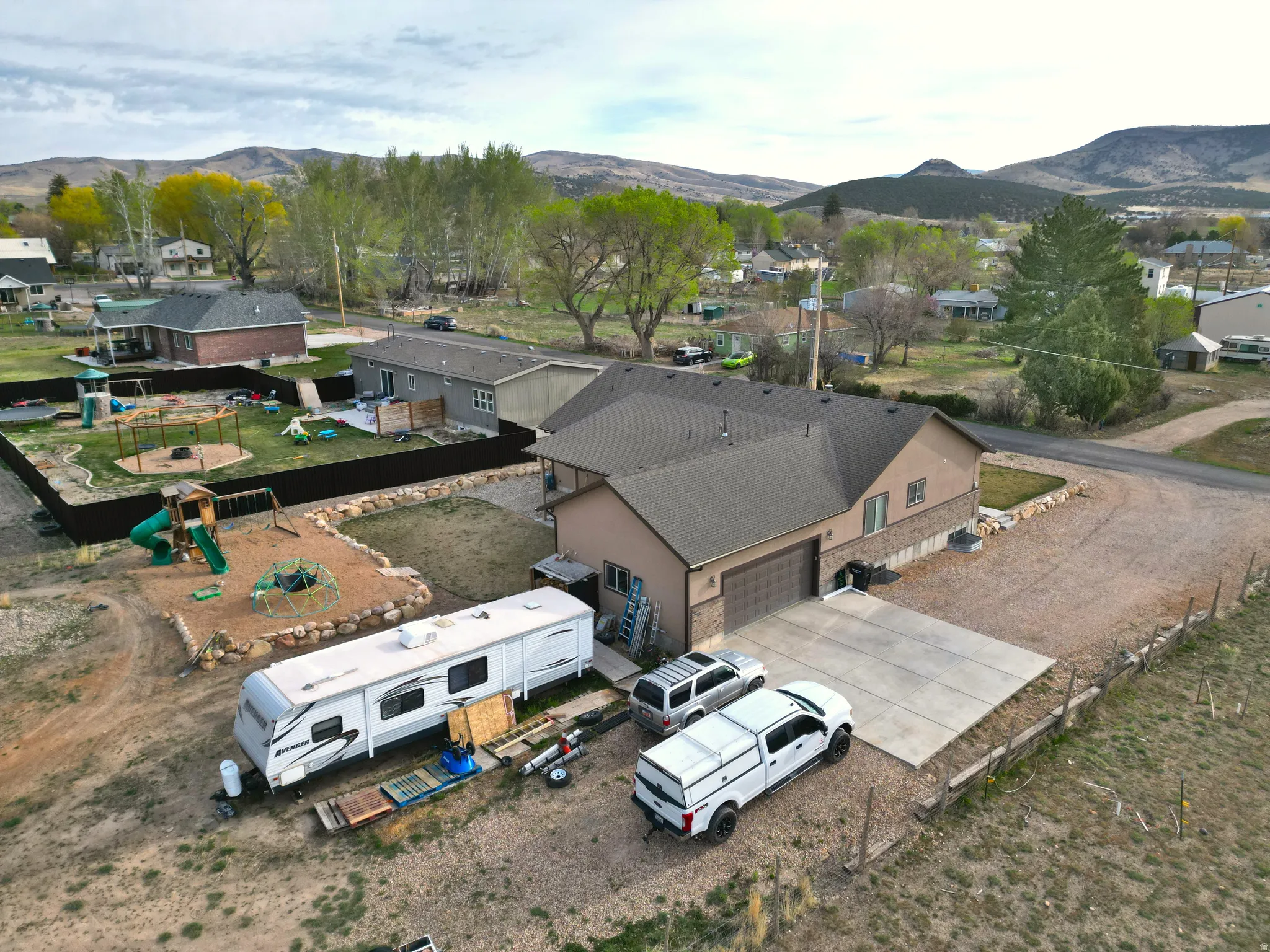 Aerial perspective of suburban area featuring a mountainous background