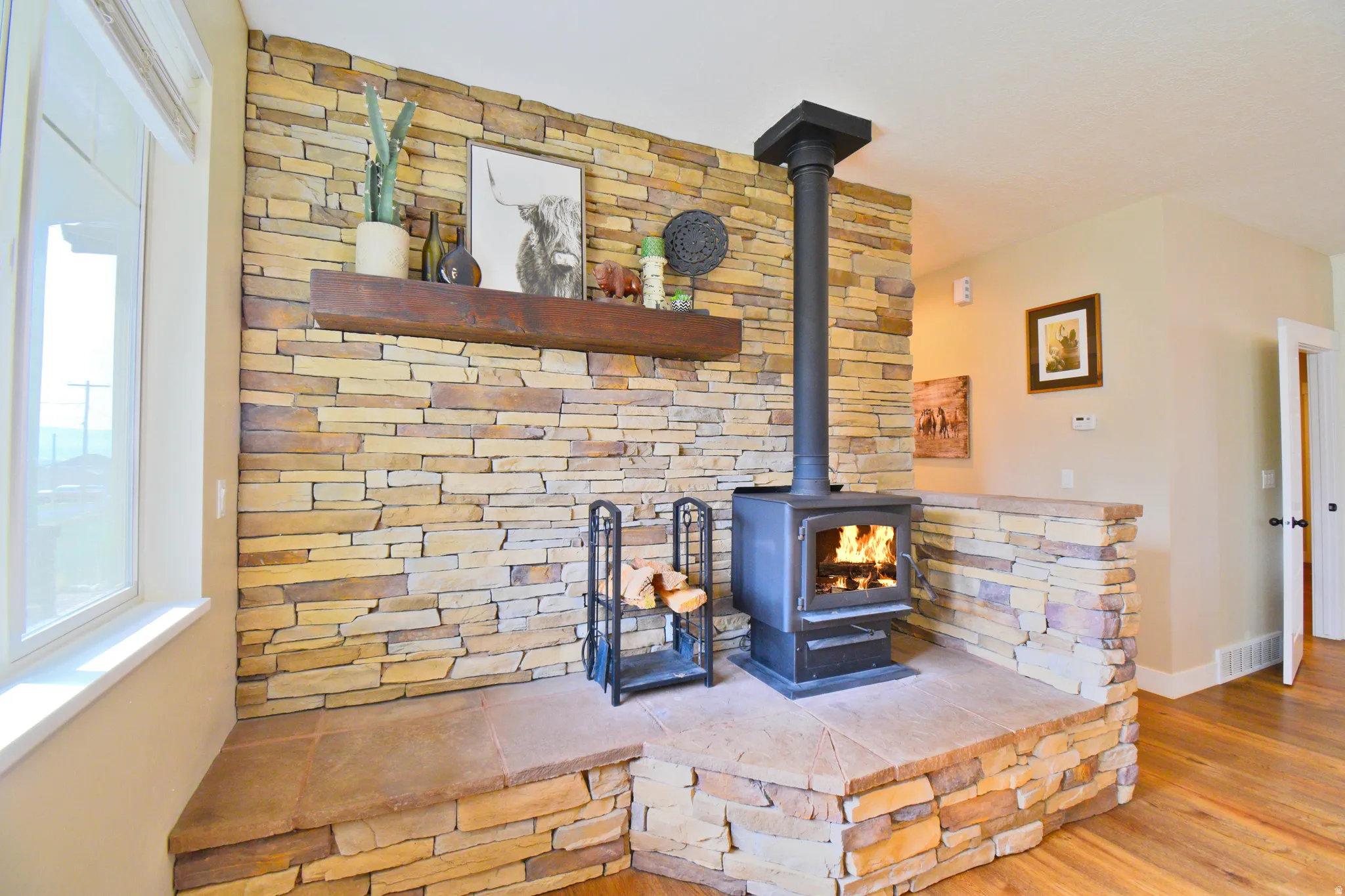 Detailed view of a wood stove and wood finished floors