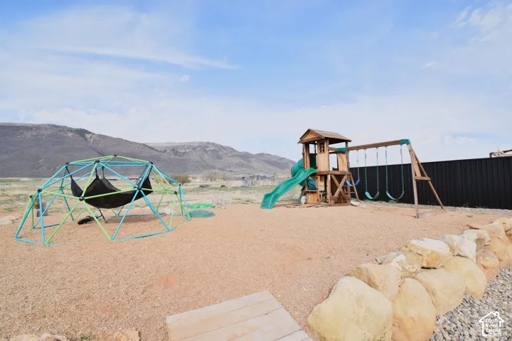 Community playground with a mountain view