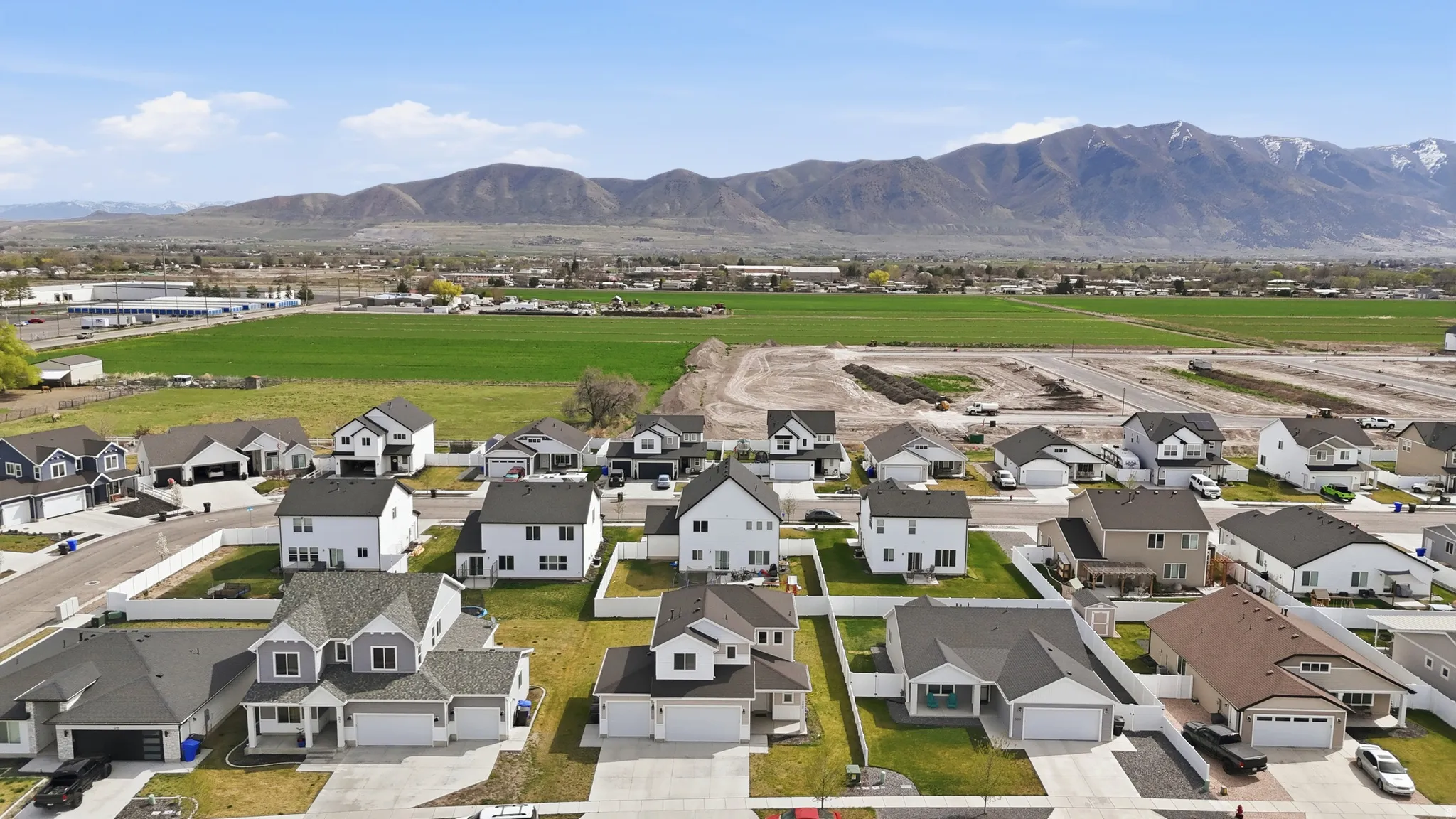 Aerial perspective of suburban area with a mountainous background
