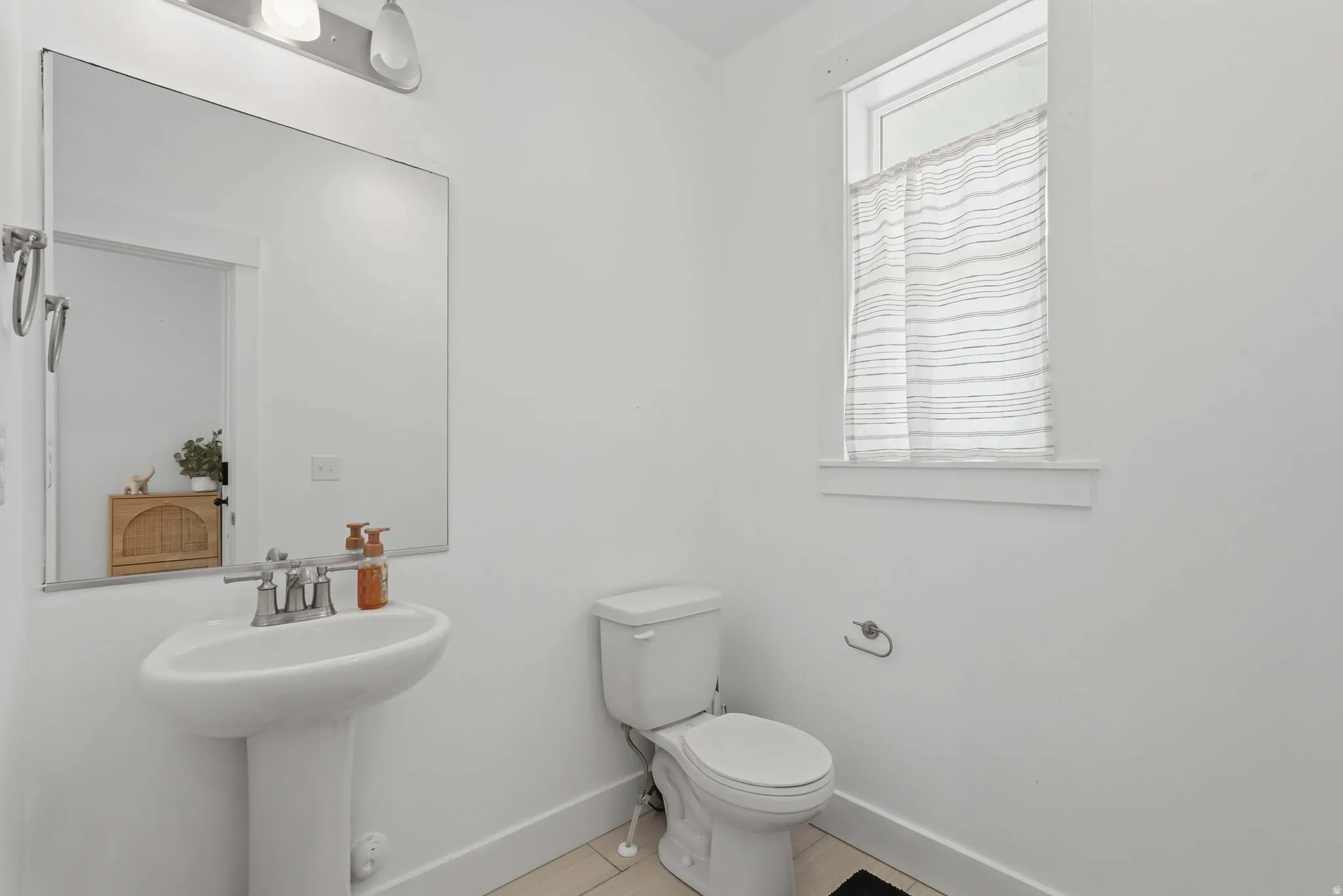Bathroom with baseboards and toilet