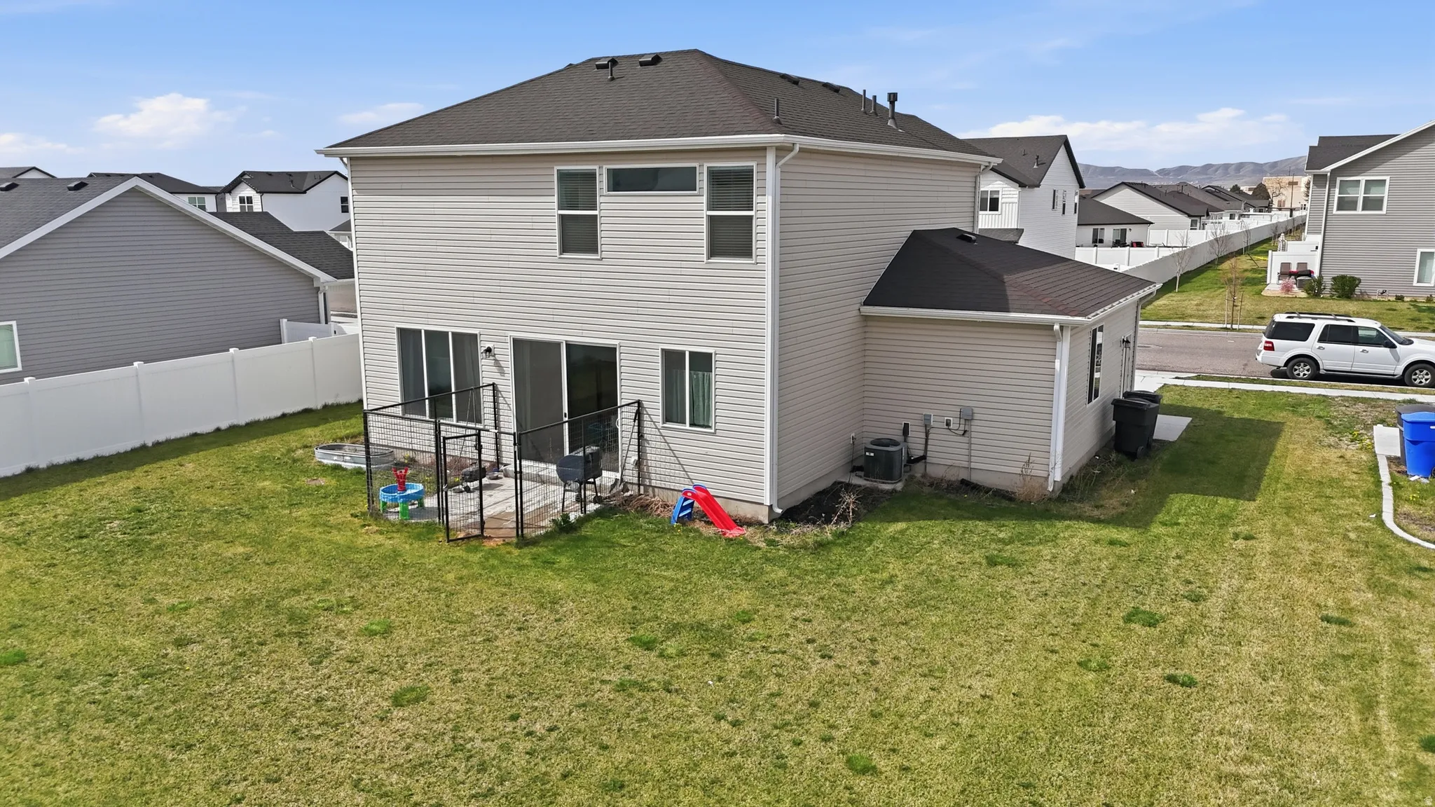 Rear view of house featuring a residential view