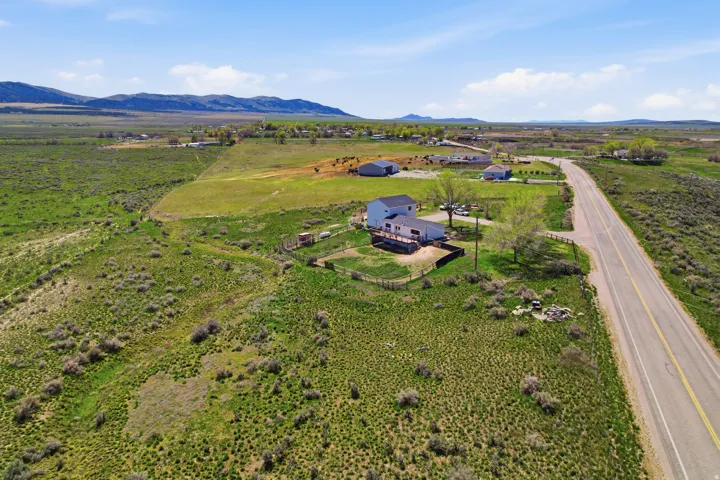 Overview of rural landscape featuring a mountain backdrop