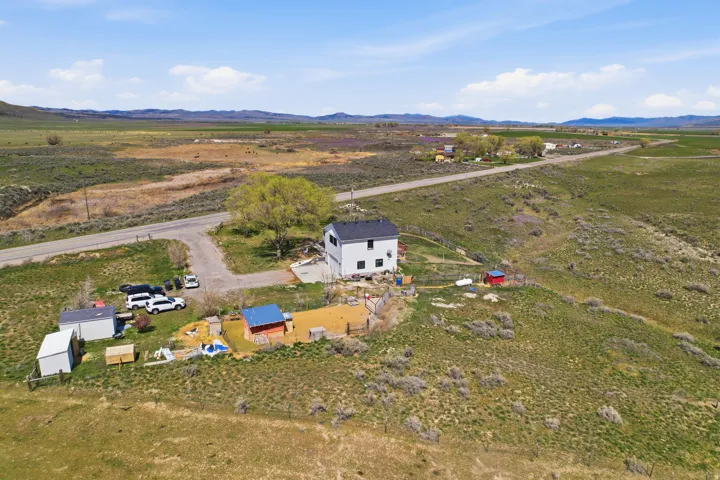 Aerial view of sparsely populated area with a mountainous background