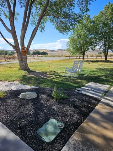 View of grassy yard with a rural view