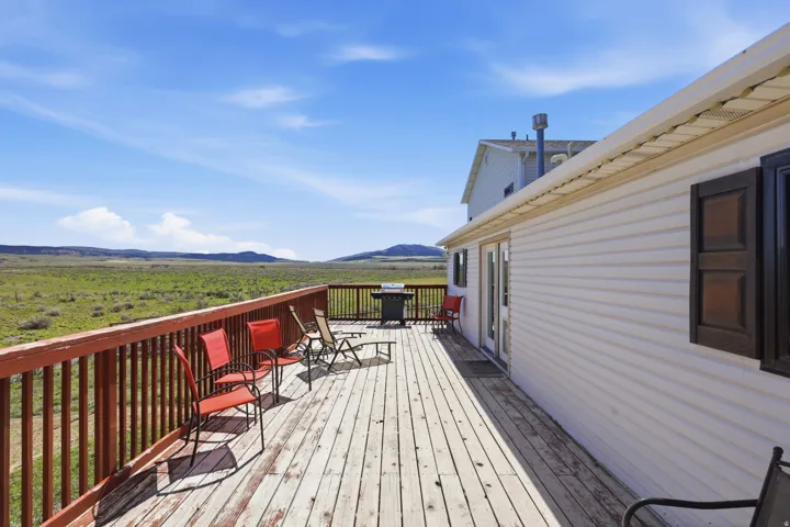 Deck with area for grilling and a mountain view