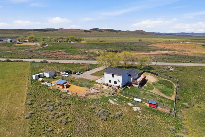 Aerial view of sparsely populated area featuring a mountainous background