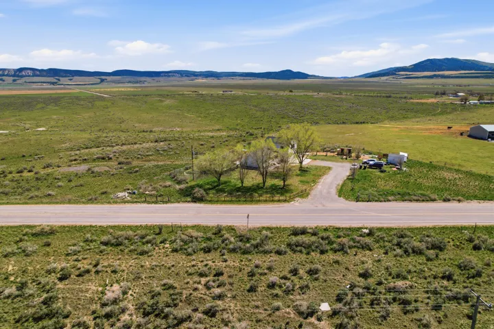 Overview of rural landscape featuring a mountainous background