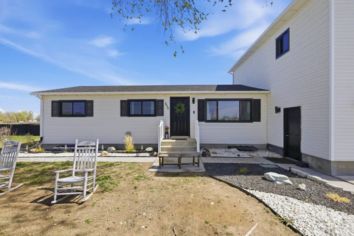 View of front of home with a shingled roof