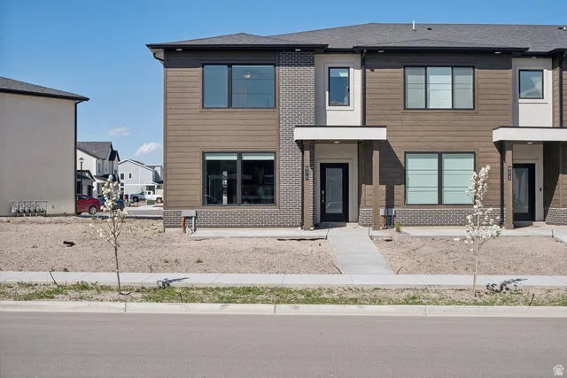 Contemporary house featuring brick siding