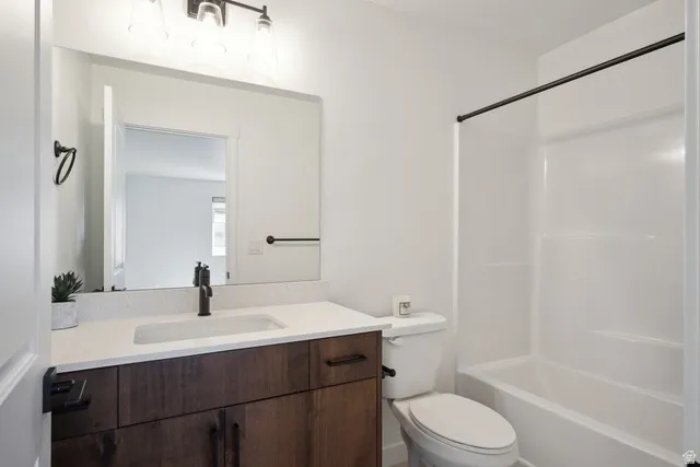 Bathroom featuring vanity and bathing tub / shower combination