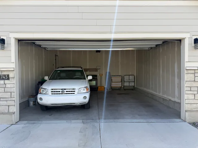 Garage with concrete driveway