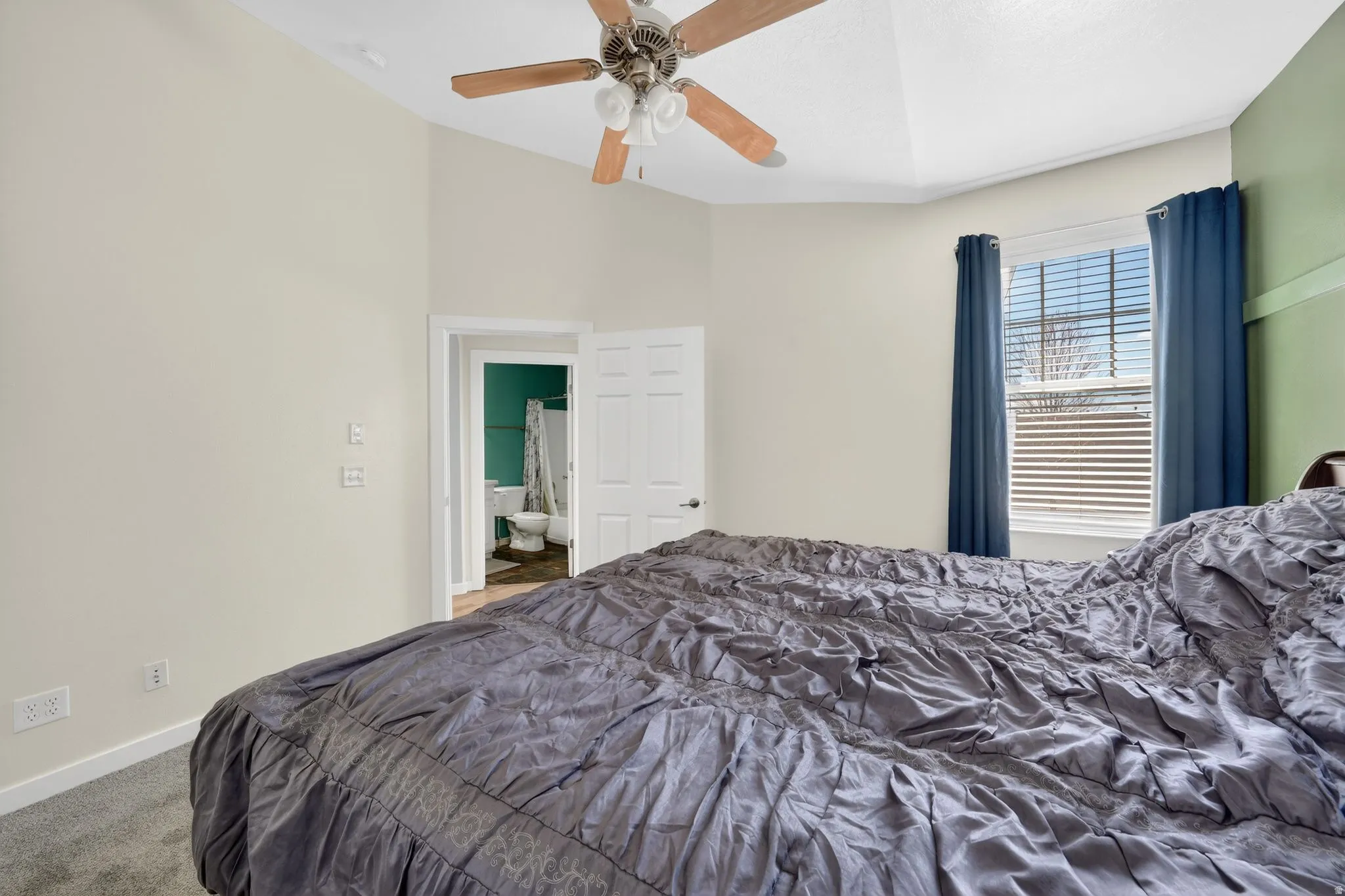 Bedroom with carpet flooring and ceiling fan