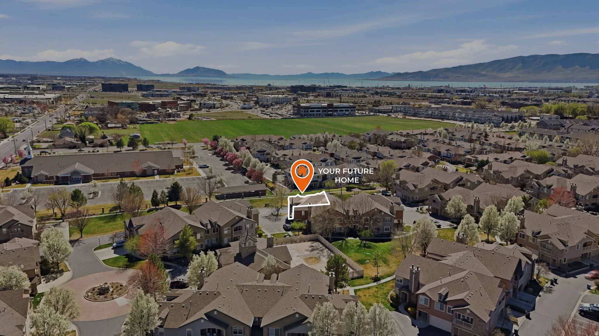 Aerial perspective of suburban area with a mountainous background