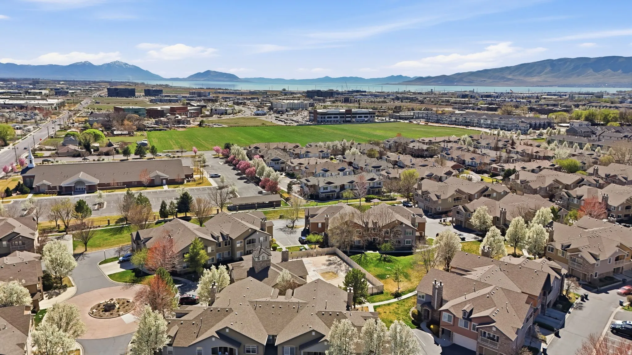 Aerial perspective of suburban area with a mountainous background