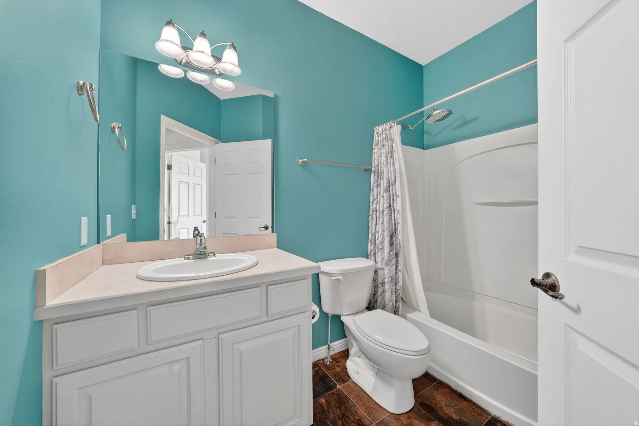 Bathroom featuring vanity and shower / bath combo