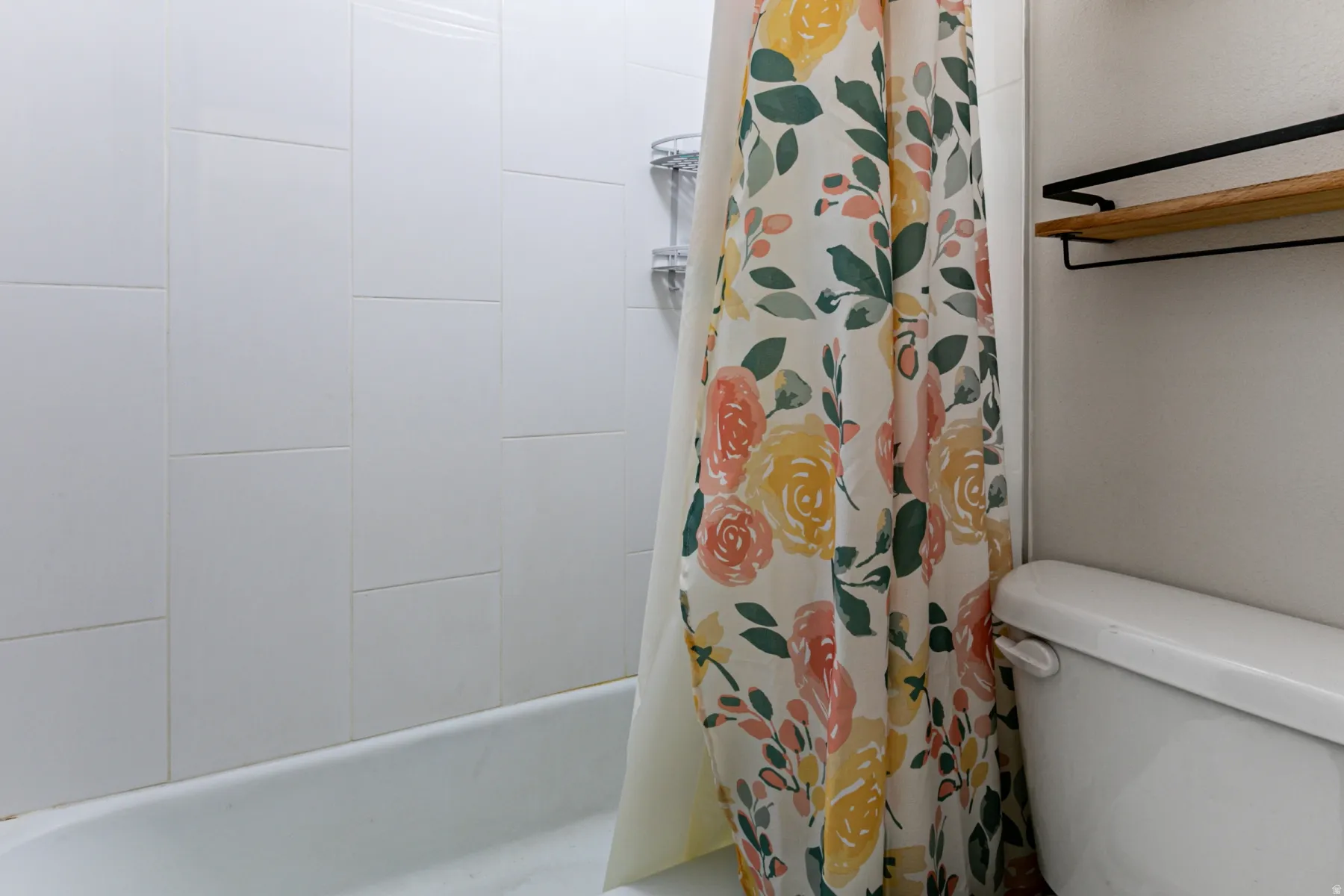 Full bath featuring toilet and shower / bathtub combination with curtain