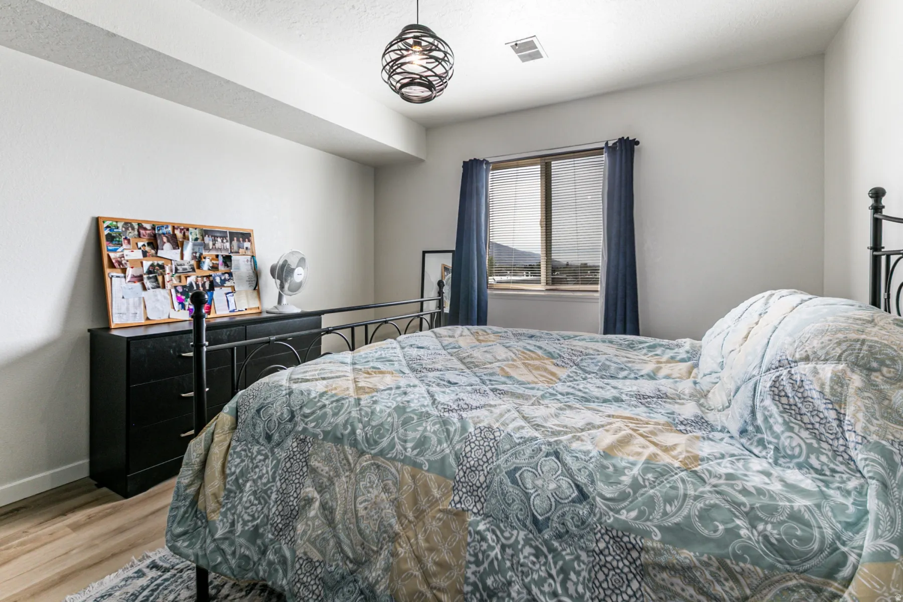 Bedroom featuring light wood finished floors and baseboards
