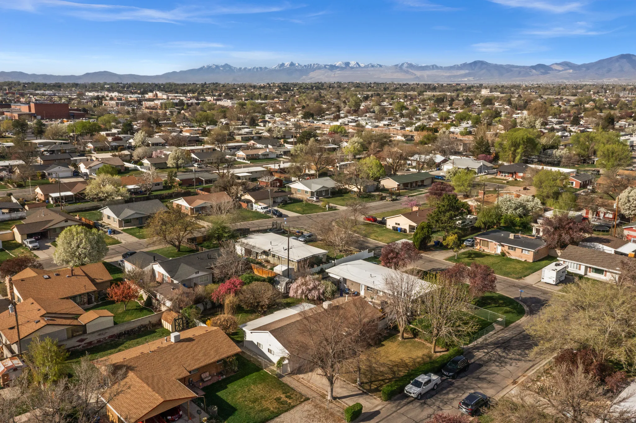 Aerial perspective of suburban area with a mountain backdrop