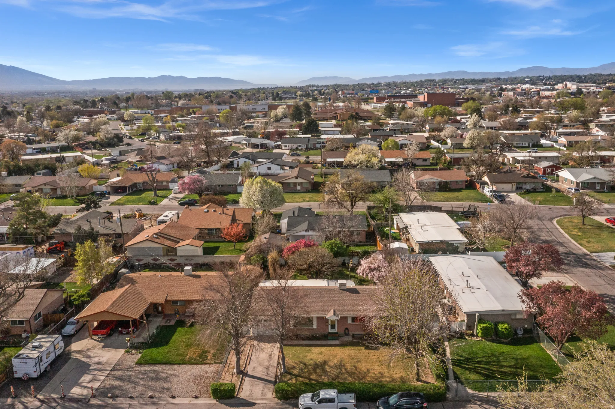 Aerial view of residential area featuring a mountain backdrop