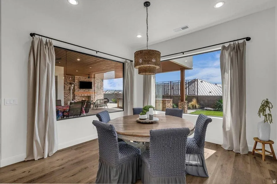 Dining area featuring wood finished floors and recessed lighting