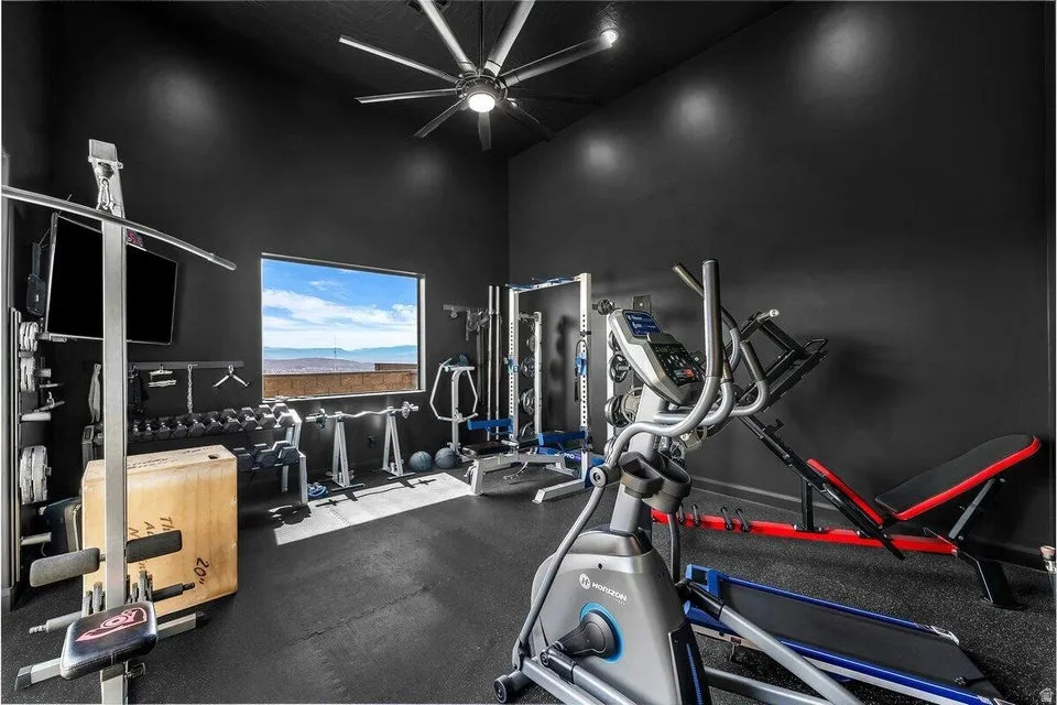 Exercise room featuring a high ceiling