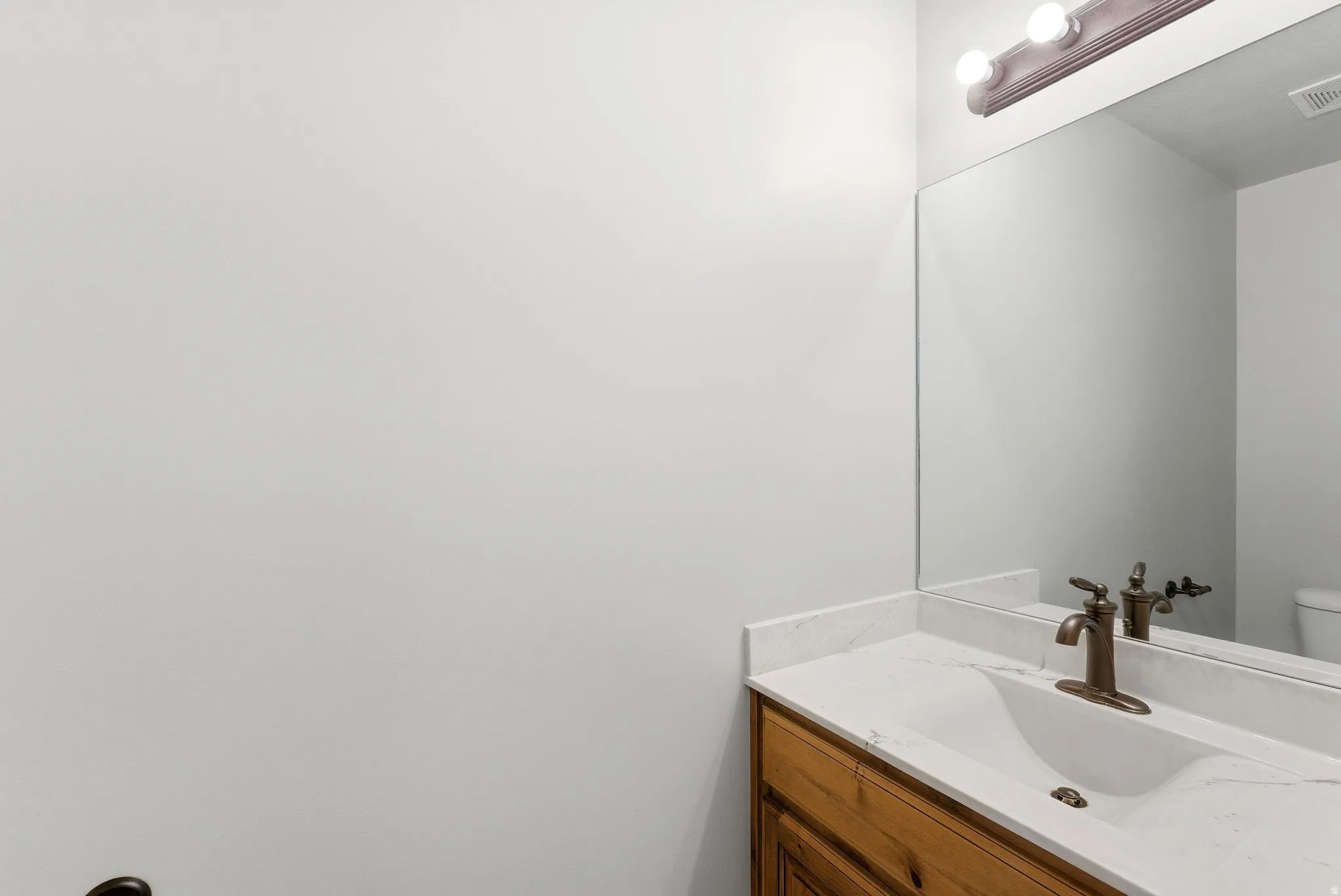 Bathroom with vanity and toilet