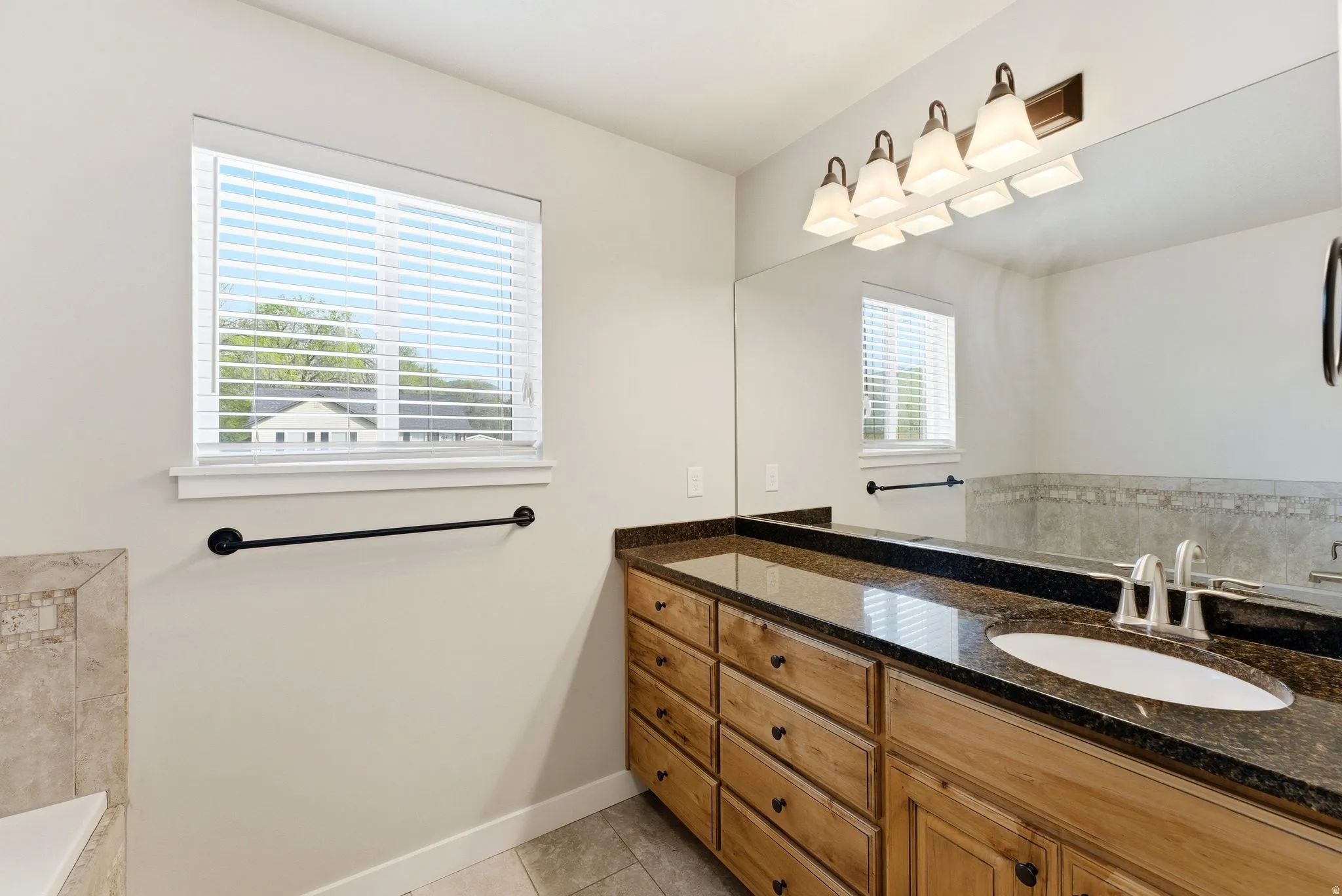 Bathroom featuring vanity and light tile patterned flooring
