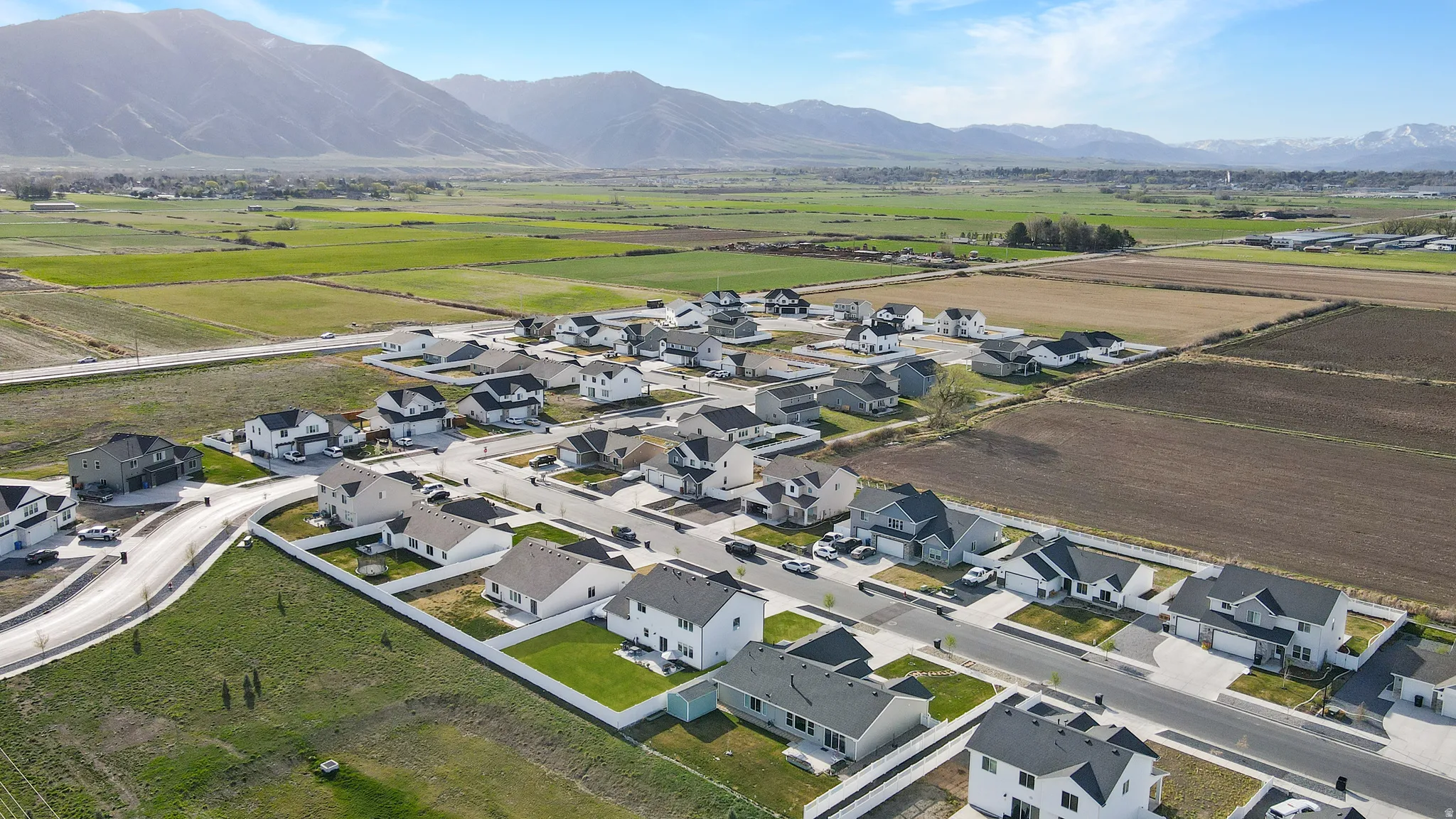 Aerial perspective of suburban area with a mountainous background