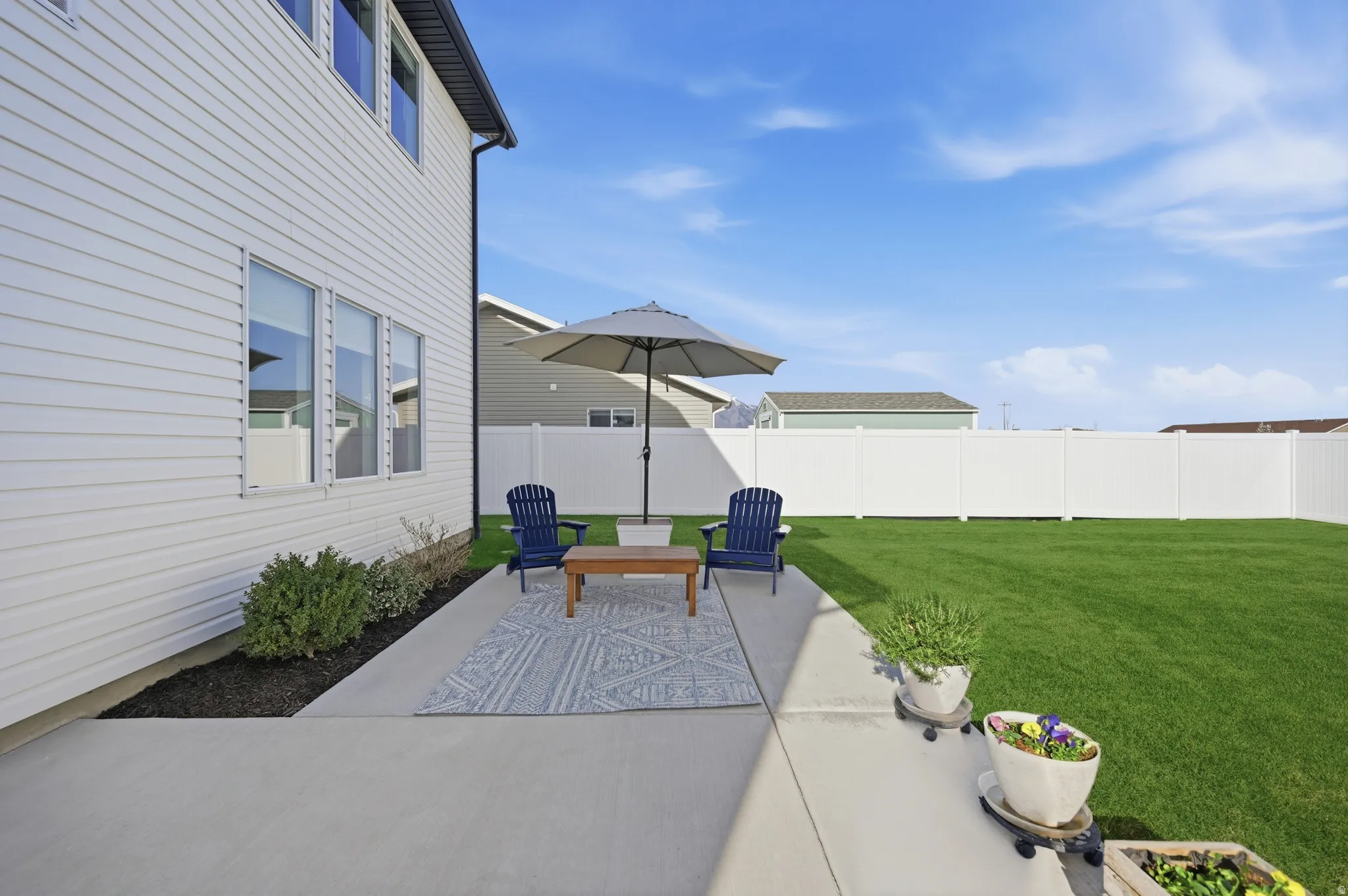 Fenced backyard featuring a patio area