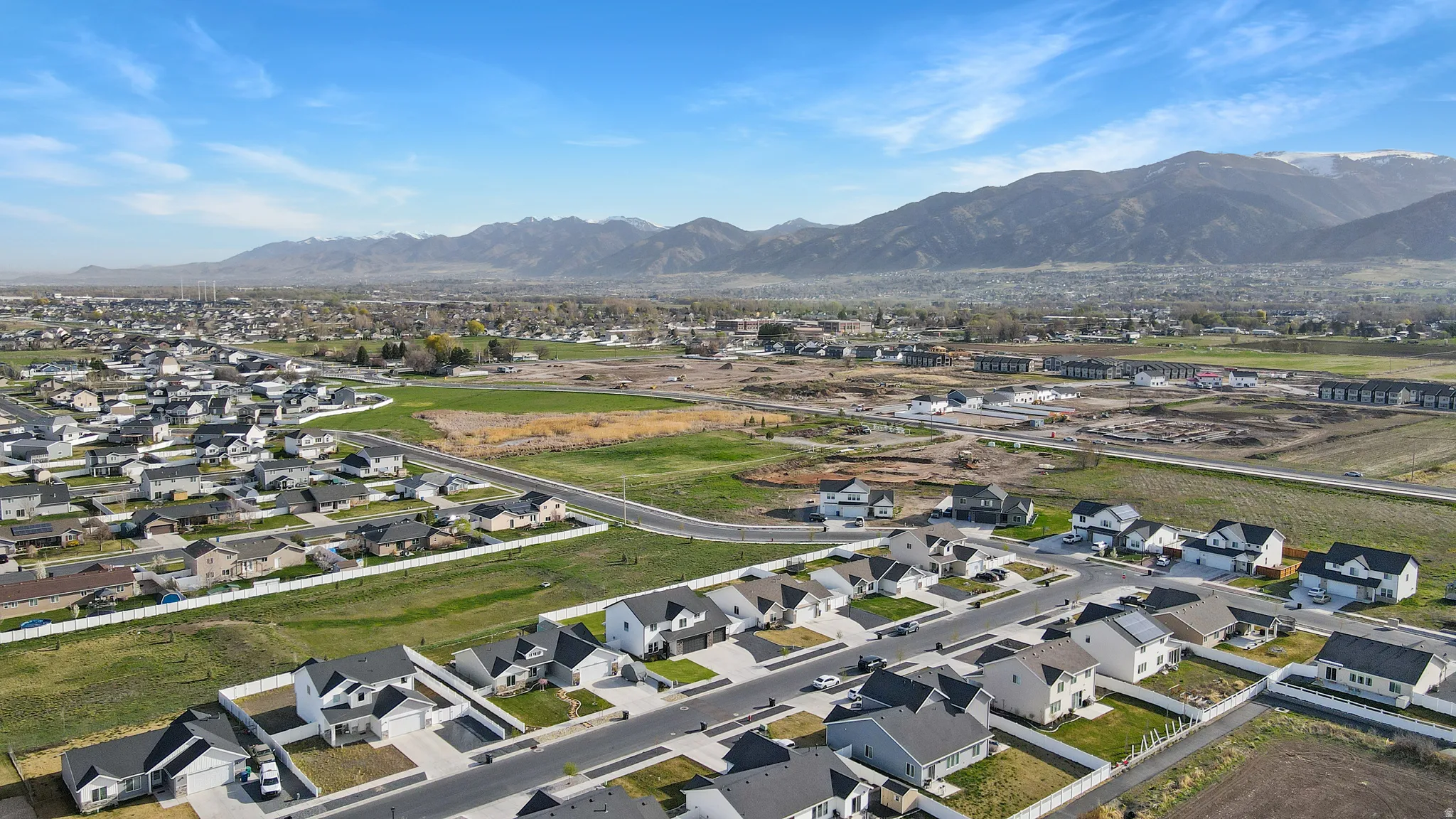 Aerial perspective of suburban area featuring a mountain backdrop