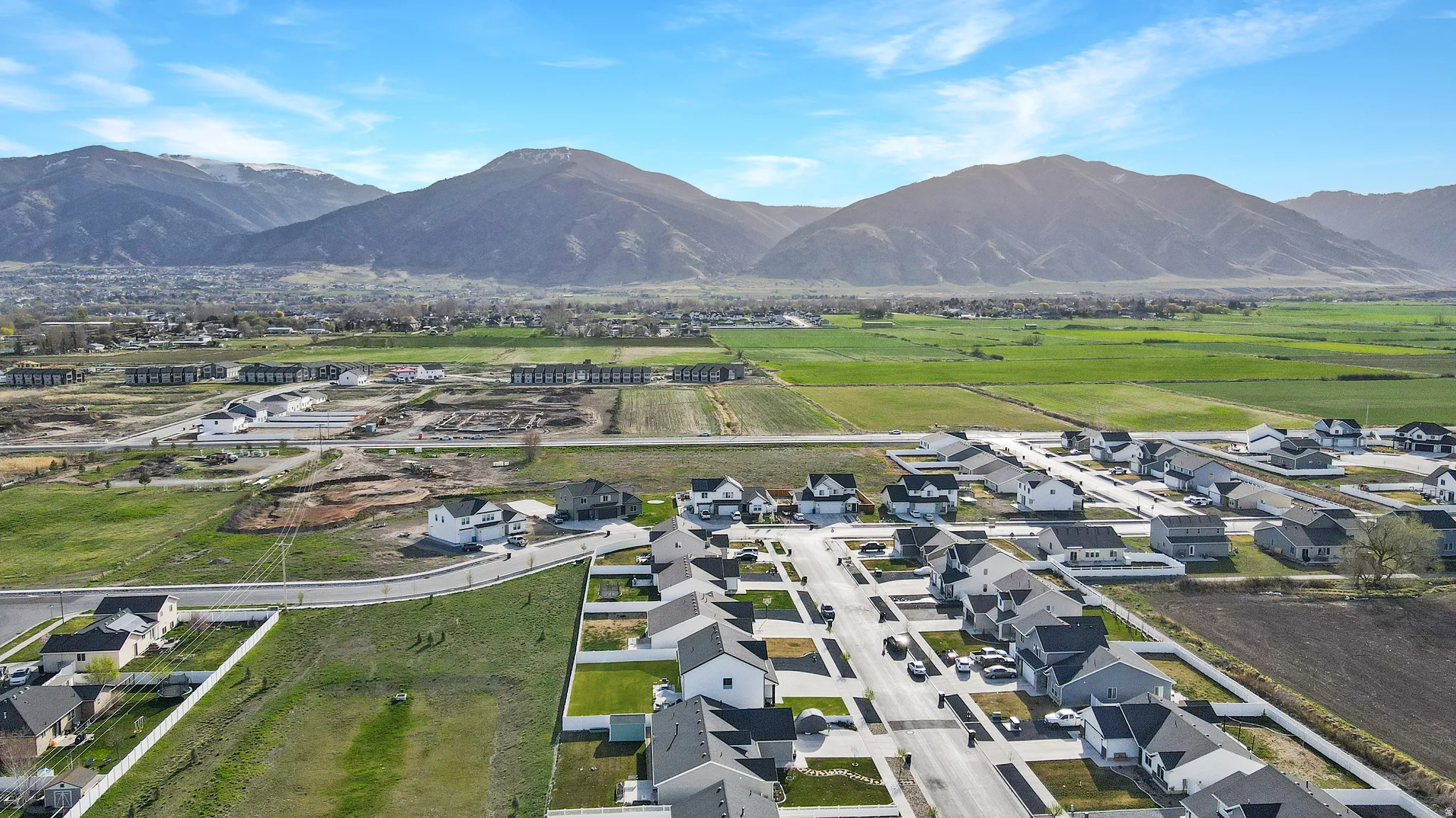 Aerial perspective of suburban area with a mountain backdrop