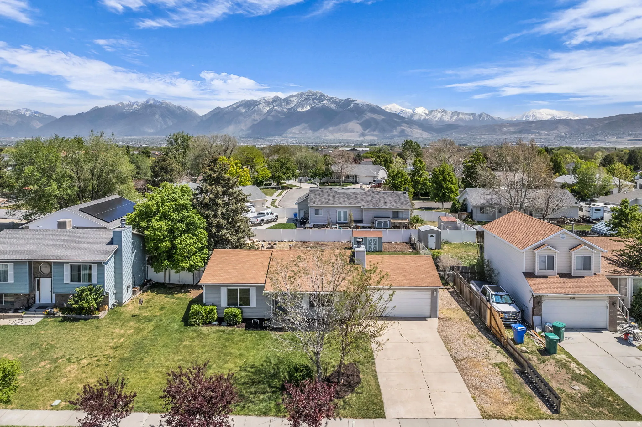 Aerial view of residential area featuring mountains