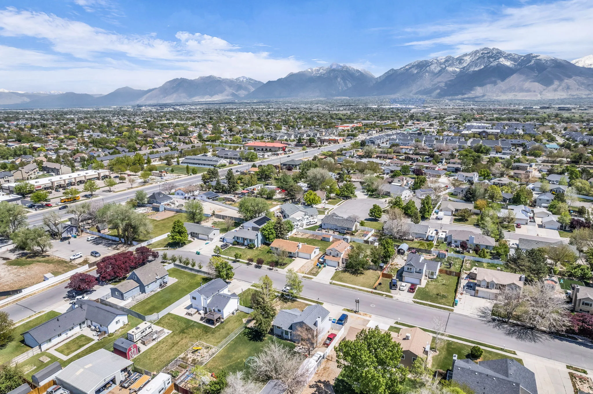 Aerial view of residential area featuring a mountainous background