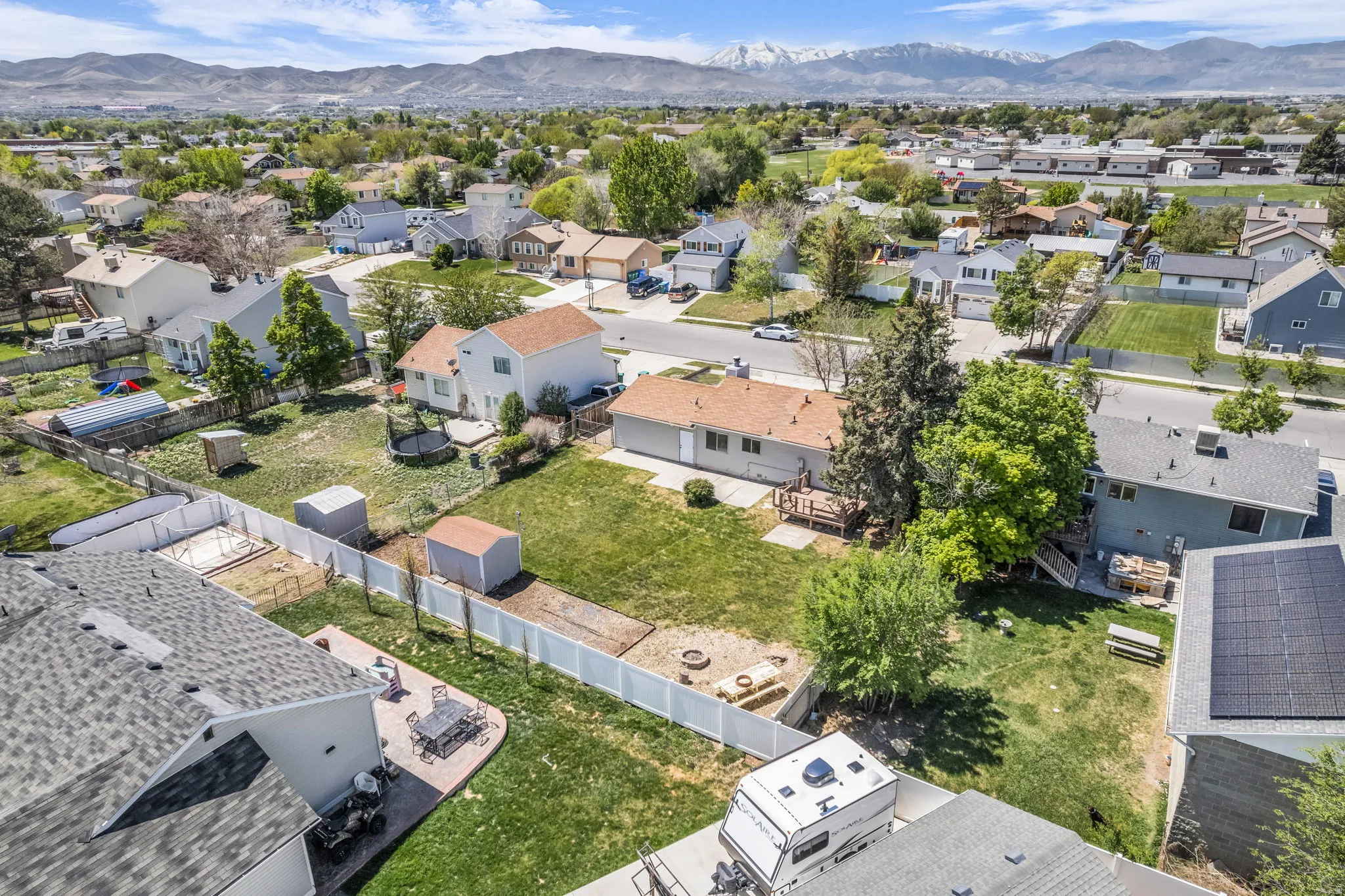 Aerial view of residential area featuring a mountainous background