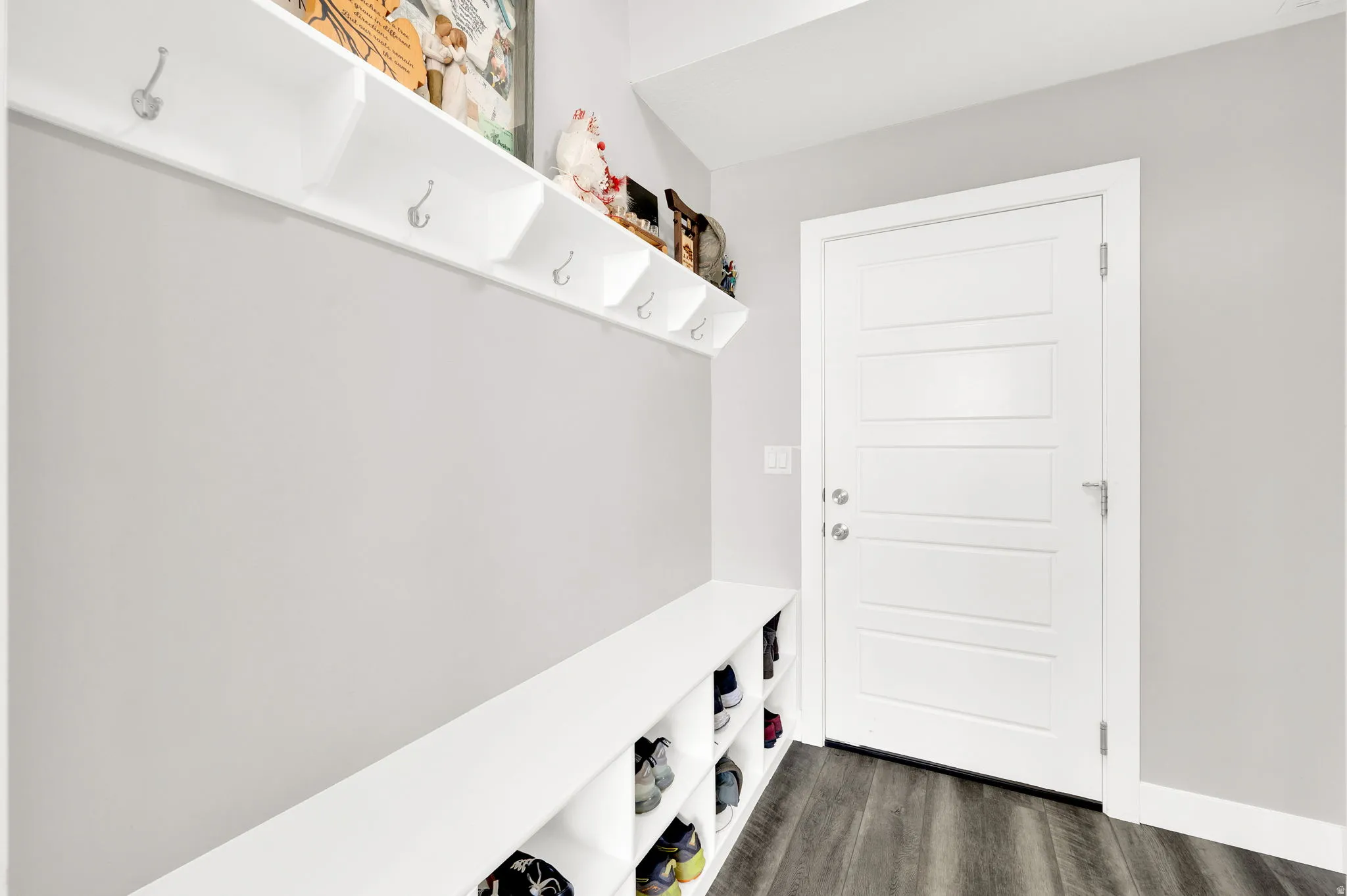 Mudroom with dark wood-type flooring