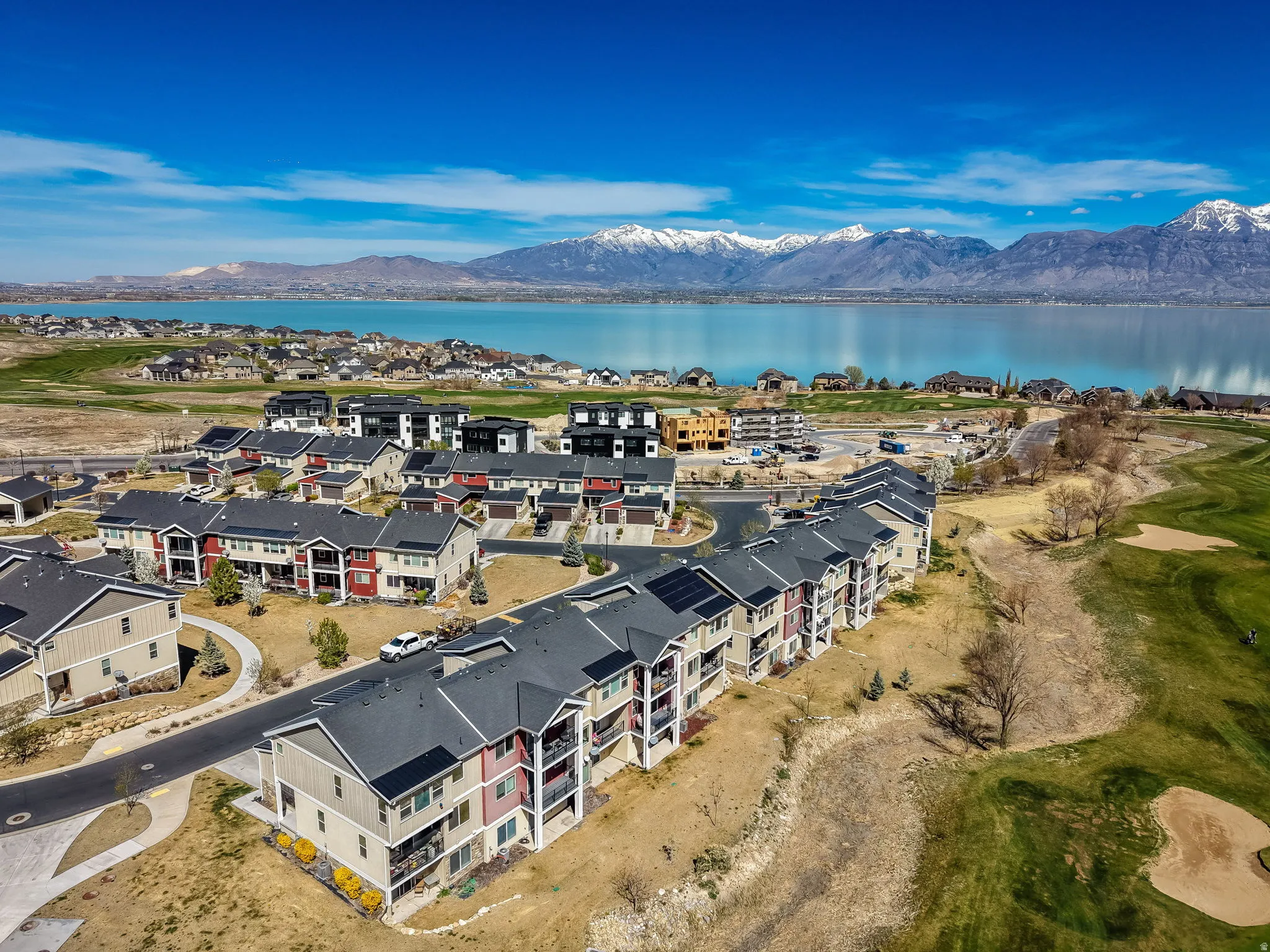 Bird's eye view of a water and mountain view and a golf club