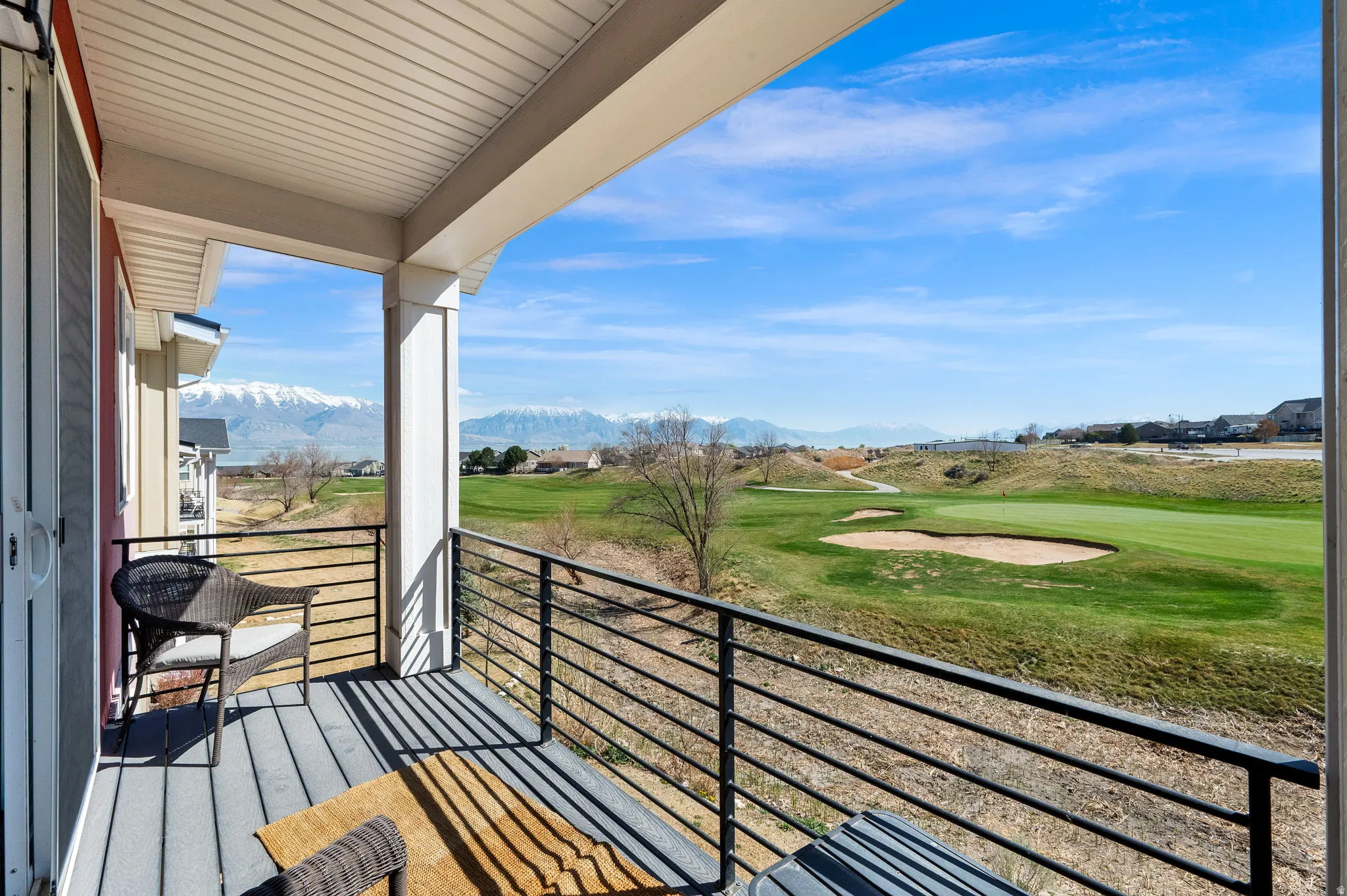 Balcony featuring a mountain view and golf course view