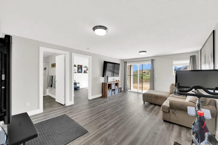 Living area featuring wood finished floors and baseboards