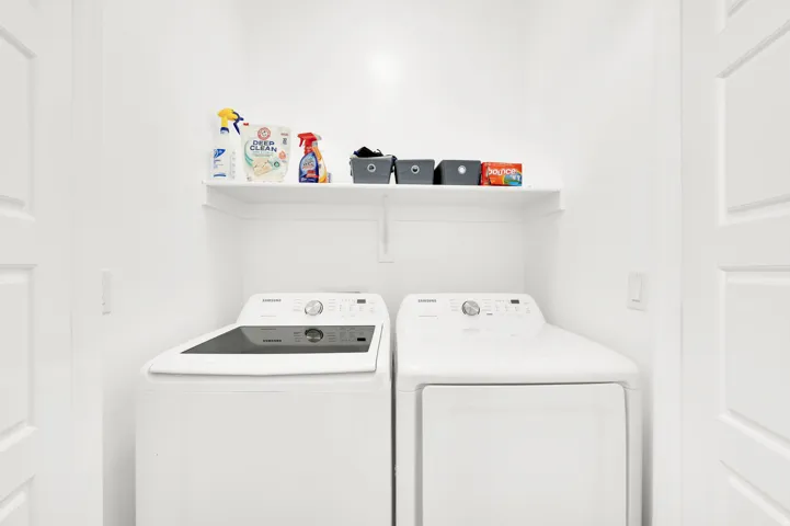 Laundry area featuring independent washer and dryer