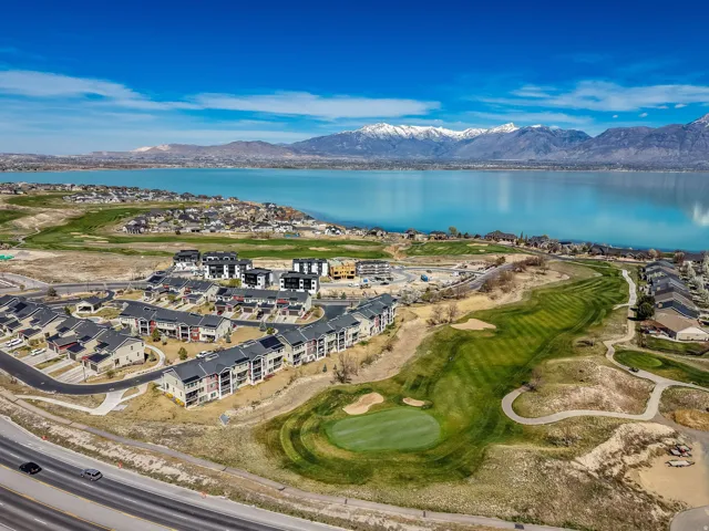 Aerial view of a golf club and a water and mountain view