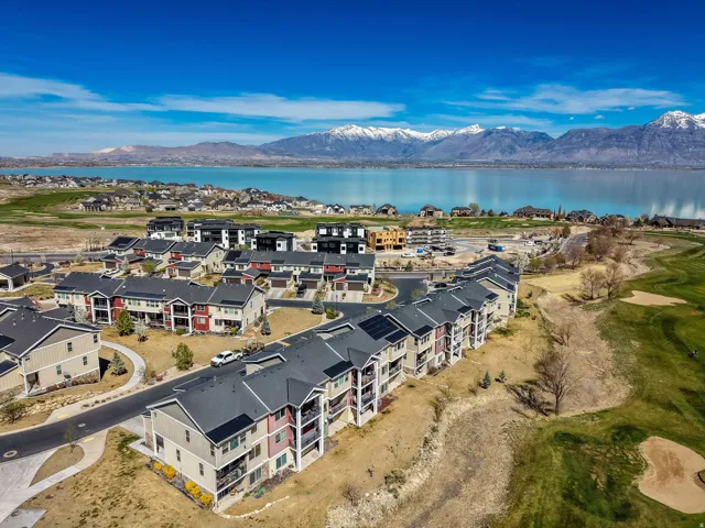 Bird's eye view of a water and mountain view and a golf club
