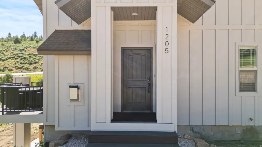 Entrance to property with board and batten siding
