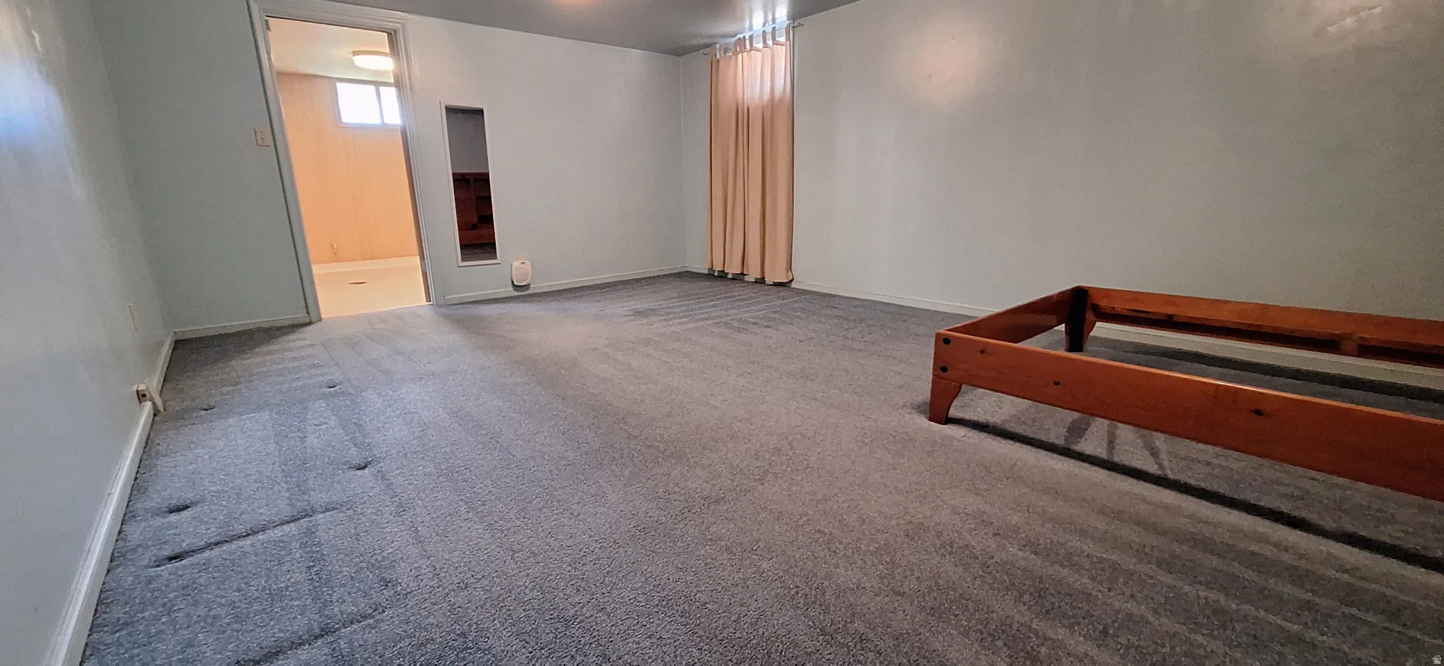 Large basement bedroom with built-in bed