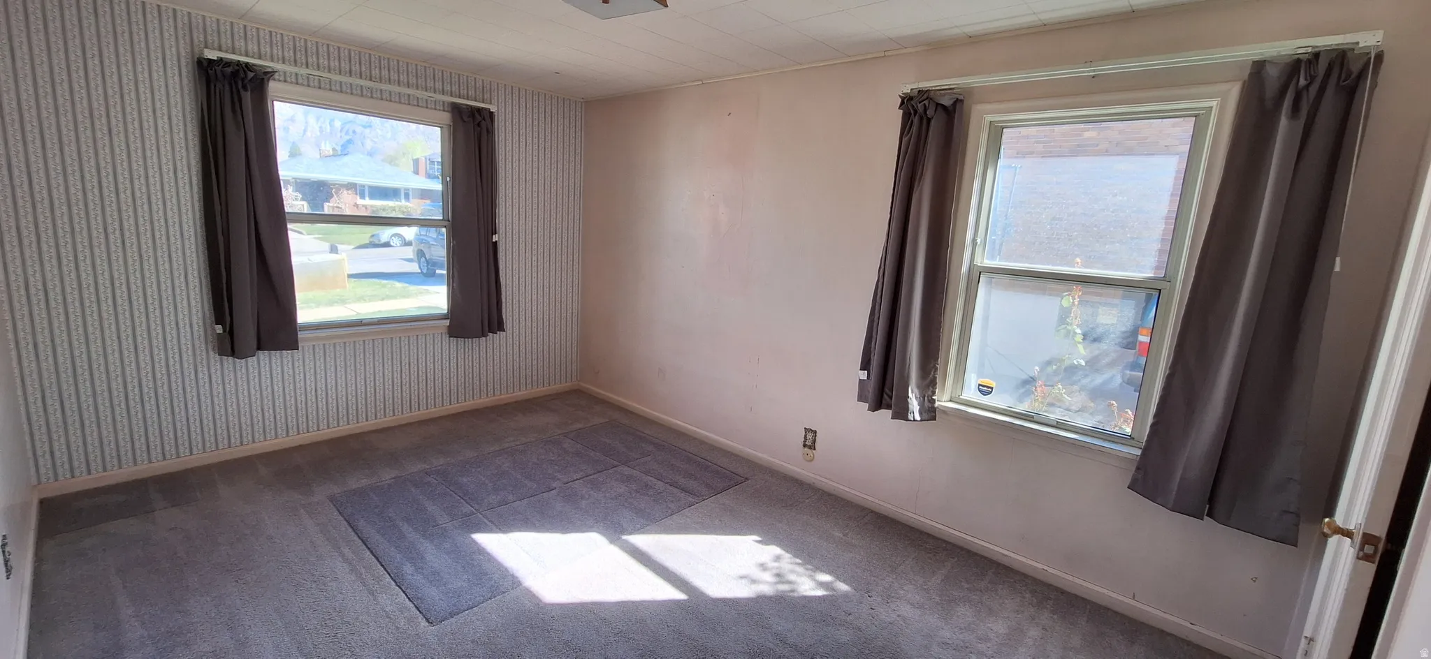 Primary bedroom showing North and East windows